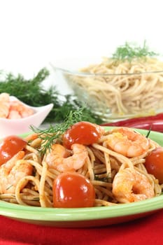 Spaghetti with tomatoes, fresh shrimp and dill