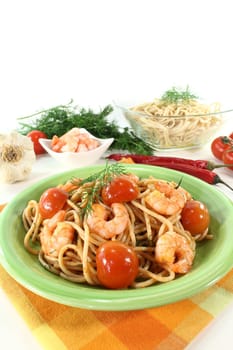 cooked Spaghetti with fresh tomatoes, shrimp and dill