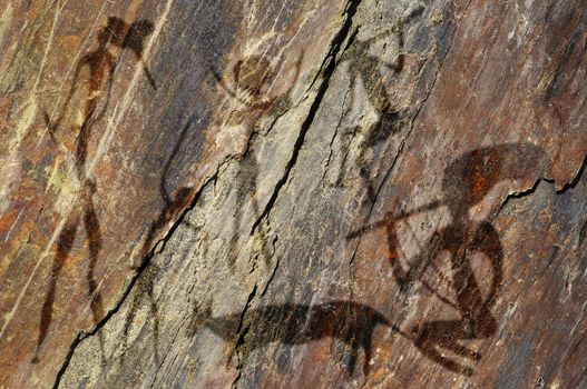 Primitive figures on the rock looks like cave painting