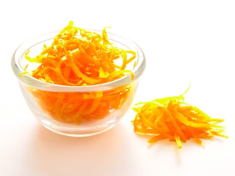 close up of a bowl of orange zest