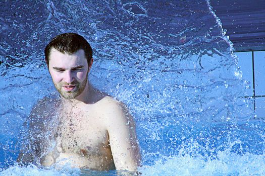 young attractive man relax in spa area