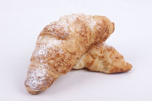 fresh almond croissant isolated on a white  background