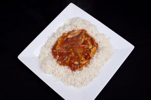 Closeup photo of chinese sweet and sour chicken with rice.