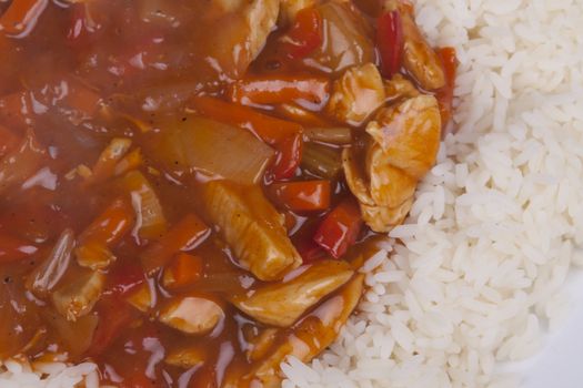 Closeup photo of chinese sweet and sour chicken with rice.