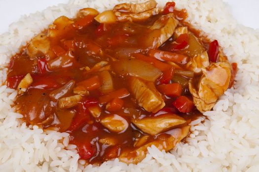 Closeup photo of chinese sweet and sour chicken with rice.