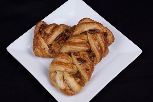 pecan and mapel pastries on a plate