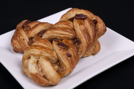 pecan and mapel pastries on a plate
