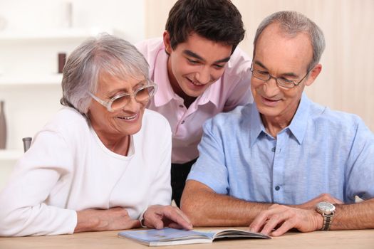 couple of senior citizens having their grandson home