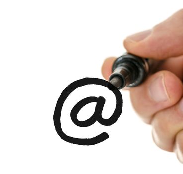 Close up of male hand writing an email symbol on a glass board. Over white background.