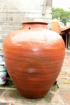 big earthen jar with grunge background