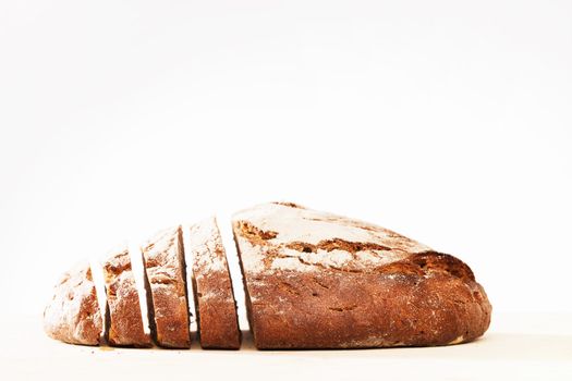 side of a sliced loaf of rustic bread