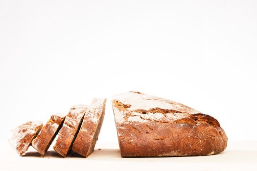 cutted loaf of rustic home made bread