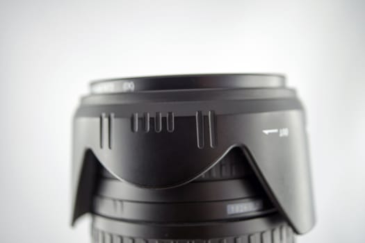 Lens with reflective gray and white background