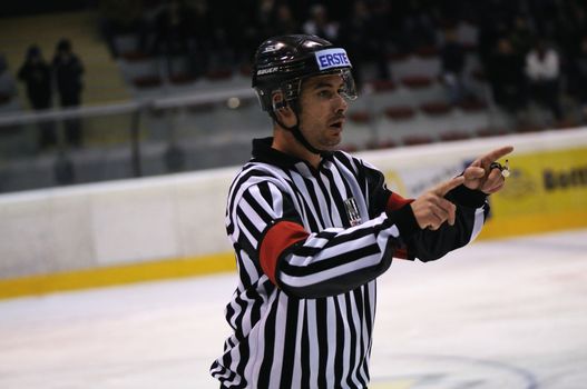 ZELL AM SEE; AUSTRIA - SEPT 24: Austrian National League. The referee warns two players. Game EK Zell am See vs EHC Lustenau (Result 1-8) on September 24, 2011 in Zell am See.