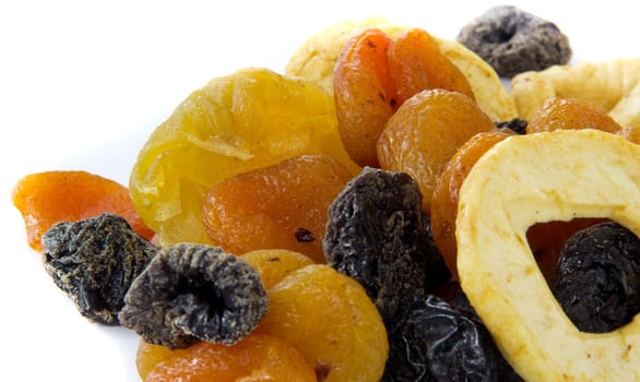 A picture of a bunch of dried fruits on a white background