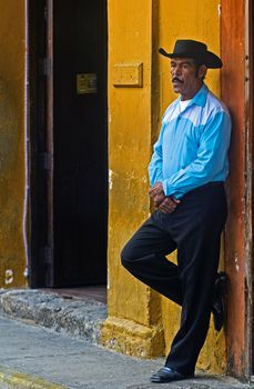 Catagena de Indias , Colombia - December 23 2010 : Colombian man standing in the street in Cartagena de indias , Colombia