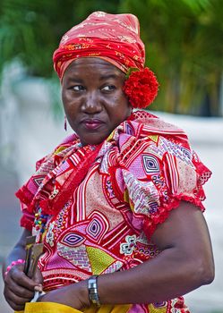 CARTAGENA , COLOMBIA - DEC 24 : Palenquera woman sell fruts in Cartagena ,Colombia on December 24 2010 , Palenqueras are  a unique African descendat ethnic group found in the north region of South America