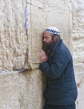 JERUSALEM - SEP 26 : Jewish man prays during the penitential prayers the "Selichot" , held on September 26 2011 in the "Wailing wall"  in  Jerusalem , Israel 