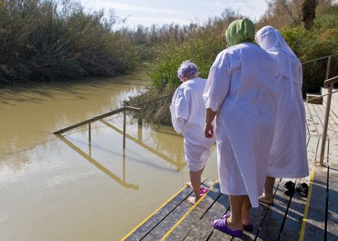 QASR AL YAHUD , ISRAEL - JAN 18 : Unidentified pilgrim women during baptising ritual the epiphany in the baptismal site Qasr al yahud in January 18 2012