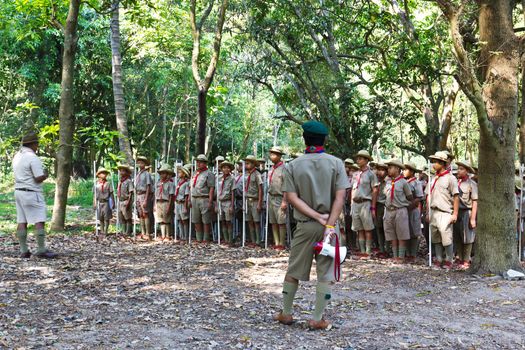 MUAKLEK, SARABURI - FEB 29: A troop of Boy Scouts marches in a Camp Parade on Feb 29, 2012 with The forest in the background in MUAKLEK, SARABURI THAILAND