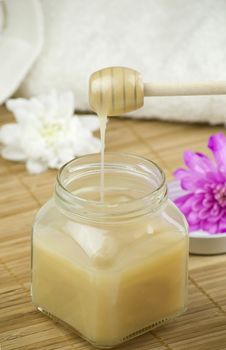 relaxing aroma of almond coconut vanilla milk and honey bath foam over wooden mat