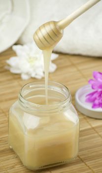 relaxing aroma of almond coconut vanilla milk and honey bath foam over wooden mat