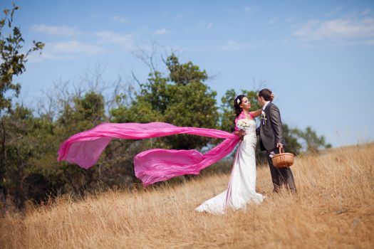 bride and groom with the pink shawl