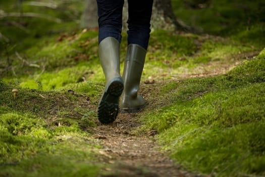 Boots in the forest from behind