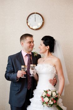 bride and groom under the clock