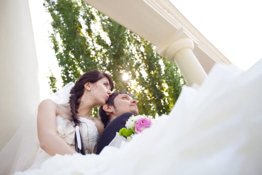 couple in columns and sunlight