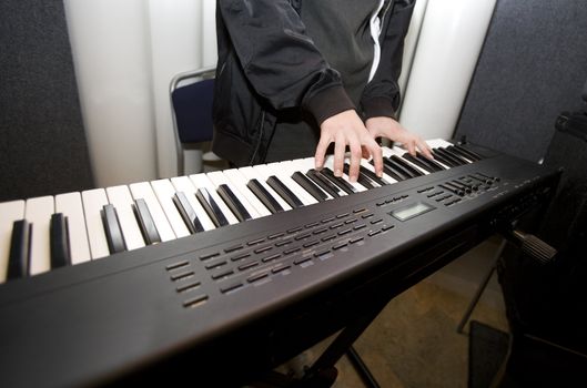 Unreconizable man playing the piano