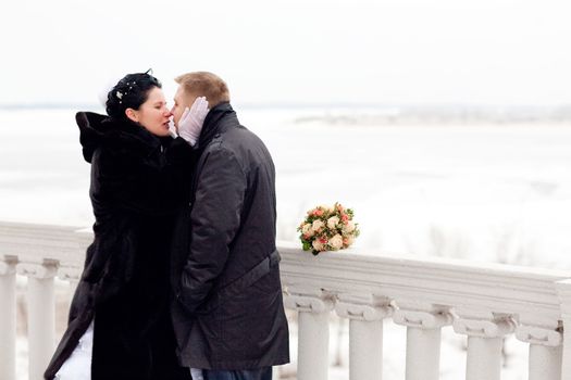 kiss in winter with frozen ears