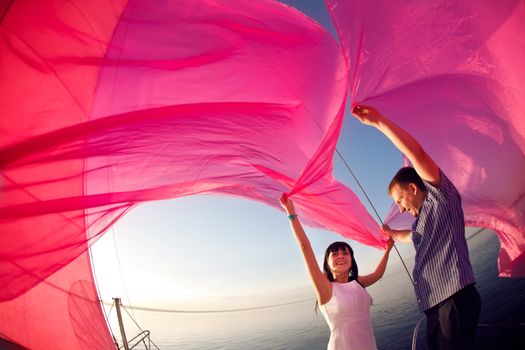 man and girl under the sail