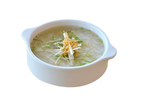 asian style rice soup with herbs in a bowl