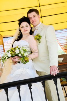 portrait of bride and groom on the balcony