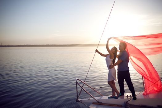 man and girl under the sail