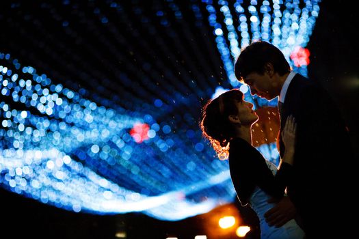 groom and bride at night