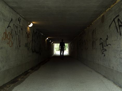 Man in a dark tunnel