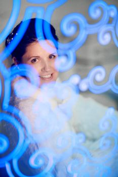 bride through the ornate glass