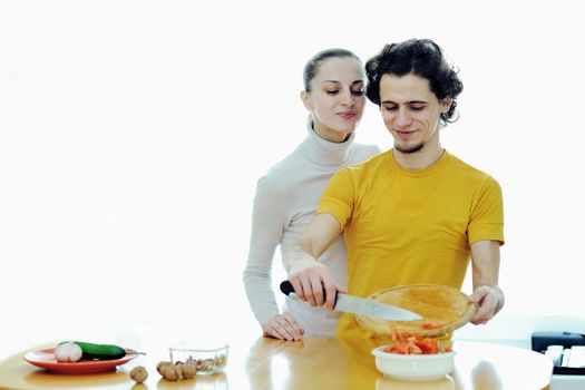 An image of couple in the kichen preparing vegetarian food