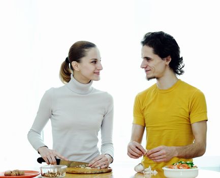 Young couple in the kichen preparing food