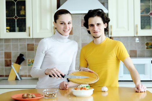 An image of couple in the kichen preparing vegetarian food