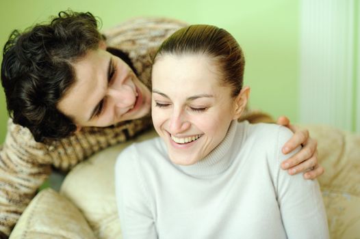 Fun young couple. Tight focus on girl. 