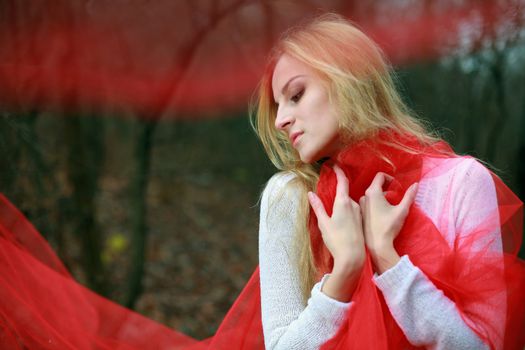 An image of a woman with a red ribbon