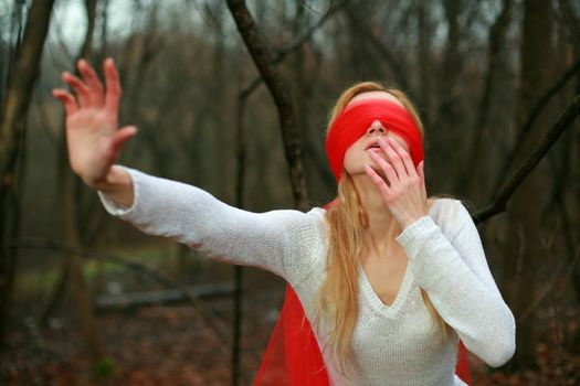 An image of woman with red blindfold