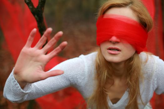 An image of woman with red blindfold