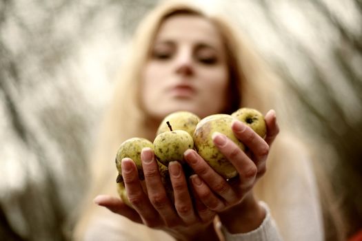 An image of woman with little apples
