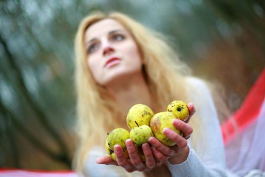An image of woman with little apples