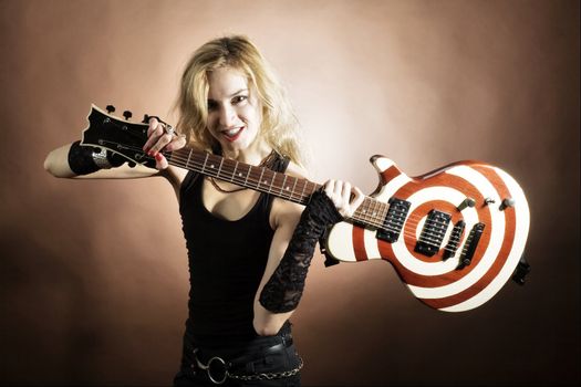 An image of a beautiful girl with guitar