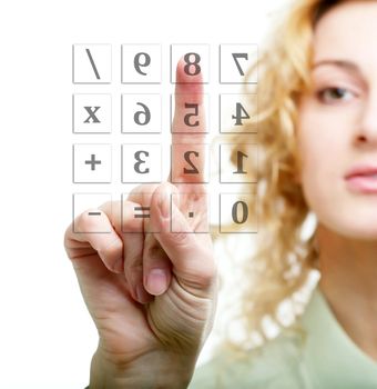 An image of a woman calculating